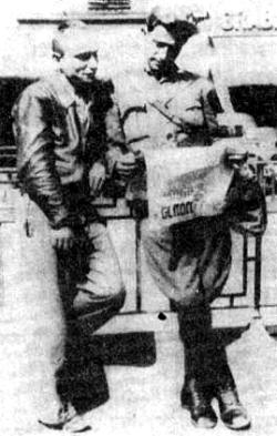 An international volunteer reading the Naye Presse, a left wing Yiddish-language paper published in Paris. On the right is the poet Olek Nuss who wrote the words of the song of the Botwin column and edited its paper.